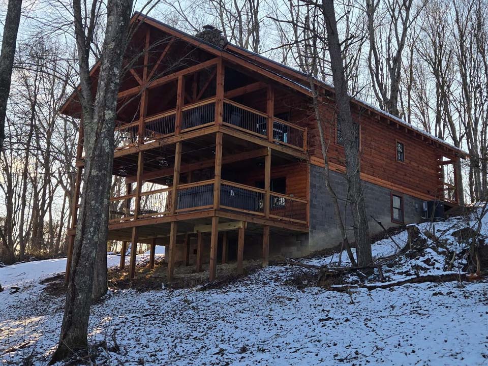WILDLIFE ESCAPES CABIN Back deck with wood burning fireplace at Hocking Hills cabin