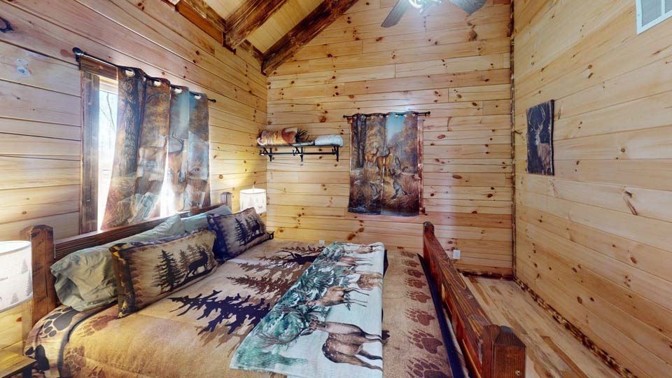 willifeesp-mar26-32 Family gathered around the outdoor fire pit roasting marshmallows.