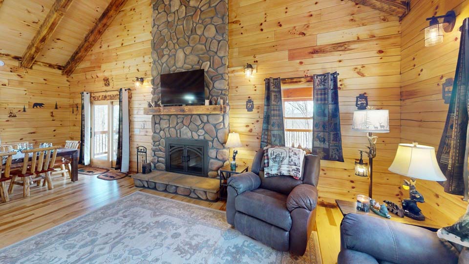 WILDLIFE ESCAPES CABIN Wide shot of the Wildlife Escape cabin surrounded by lush Hocking Hills greenery.